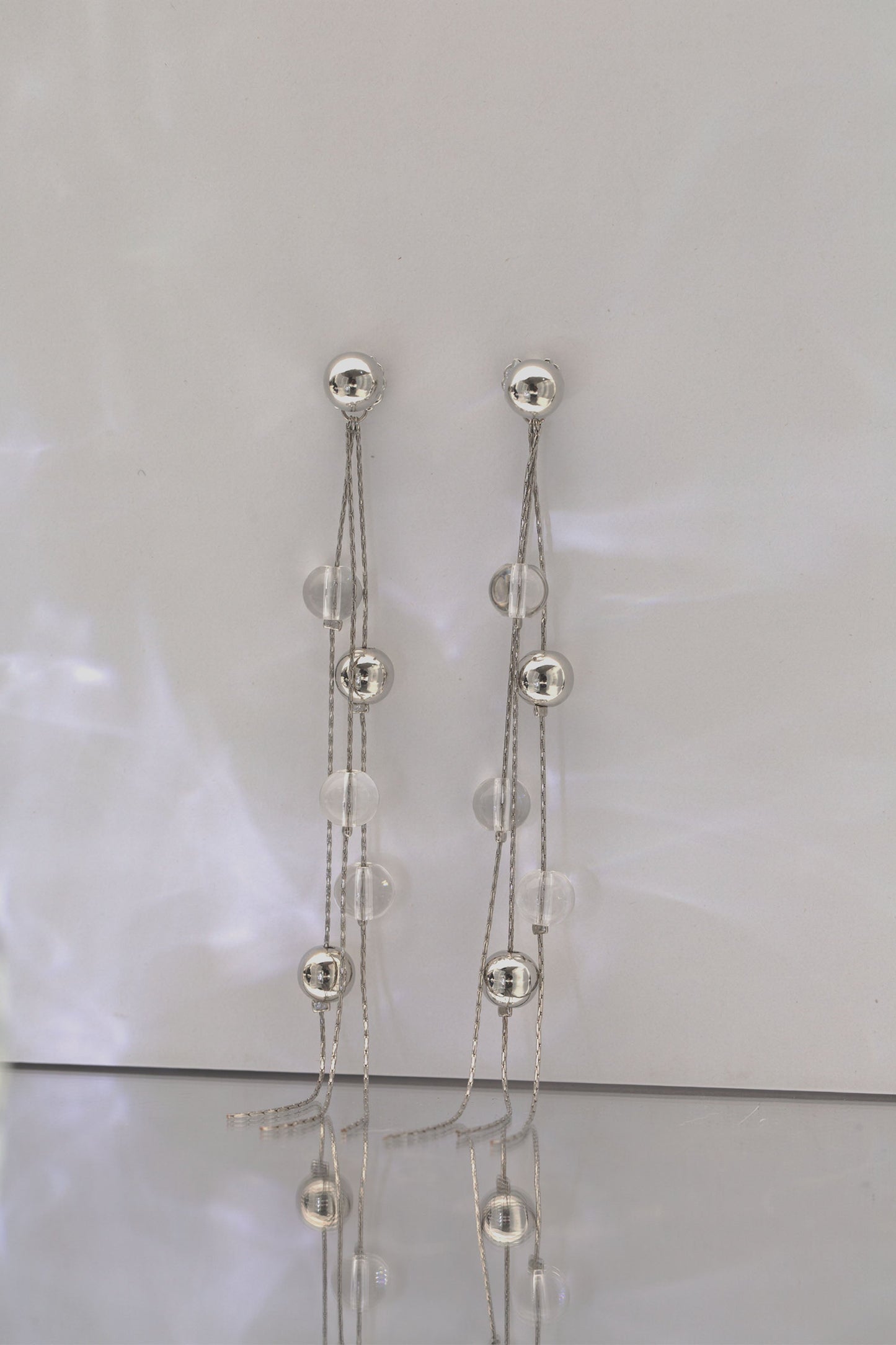 FrostLily Clear Crystal and Silver Bead Drop Earrings